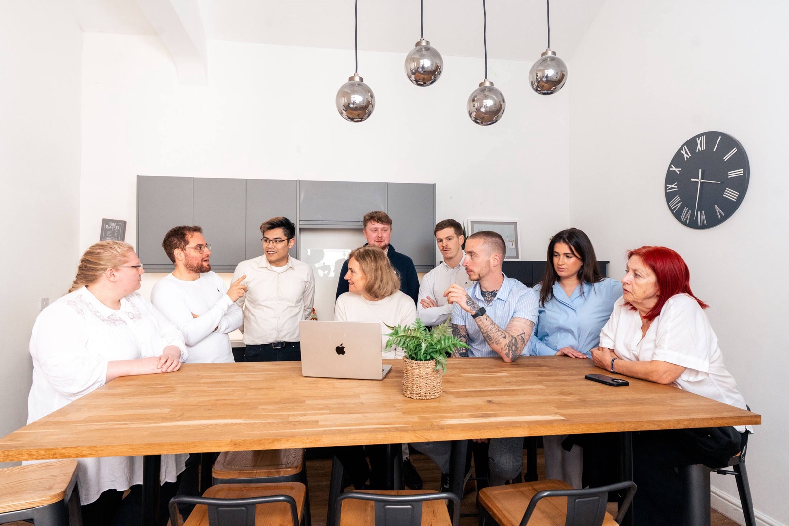The Point Properties team working together around the table at the Smithdown Road office